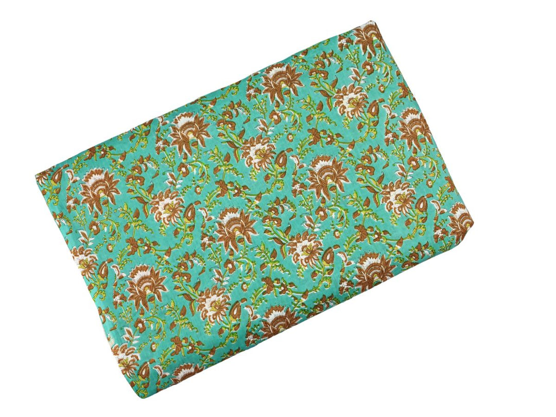 Indian woodblock print cotton fabric with paisley motifs on turquoise