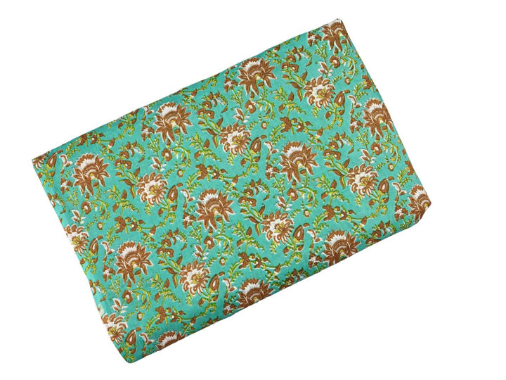 Indian woodblock print cotton fabric with paisley motifs on turquoise
