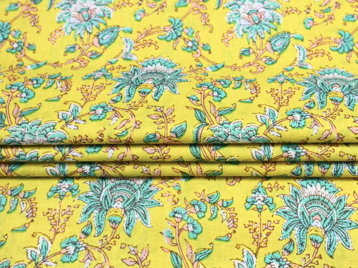Close-up of chartreuse woodblock floral fabric with teal scalloped petals