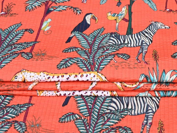 Coral quilted fabric by the yard with Jaipur jungle animal print