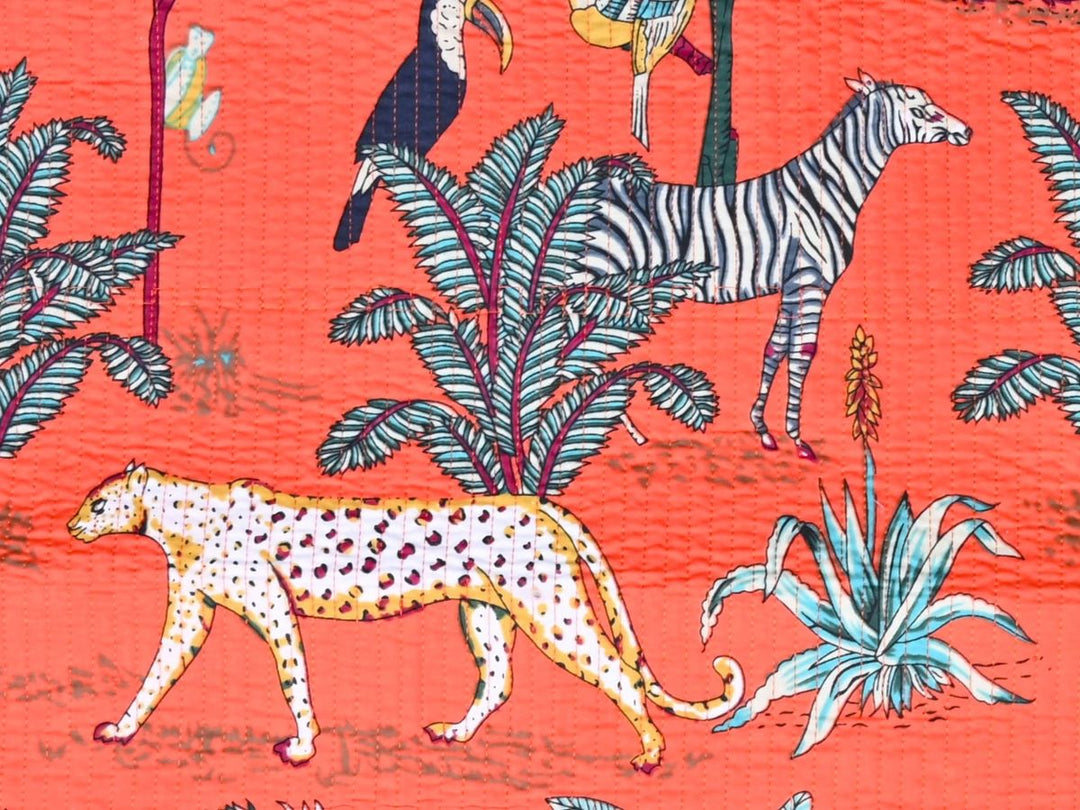 400 GSM quilted fabric with toucan and parrot motifs on coral ground