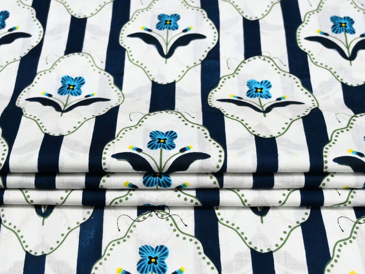 Quilting cotton fabric showing whimsical bow accents and dotted borders
