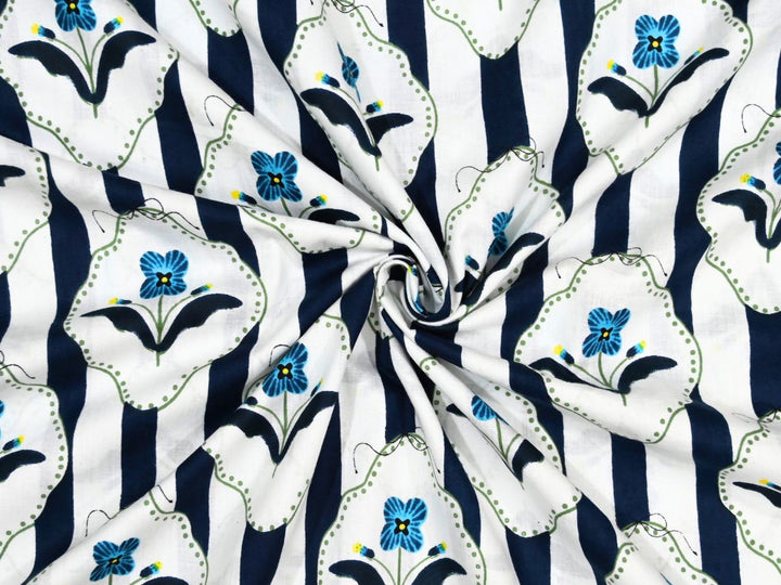 Navy and white striped cotton fabric with blue flowers in scalloped frames