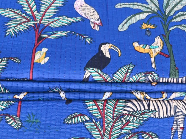 Blue jungle quilted fabric by the yard with cheetah and zebra animal print