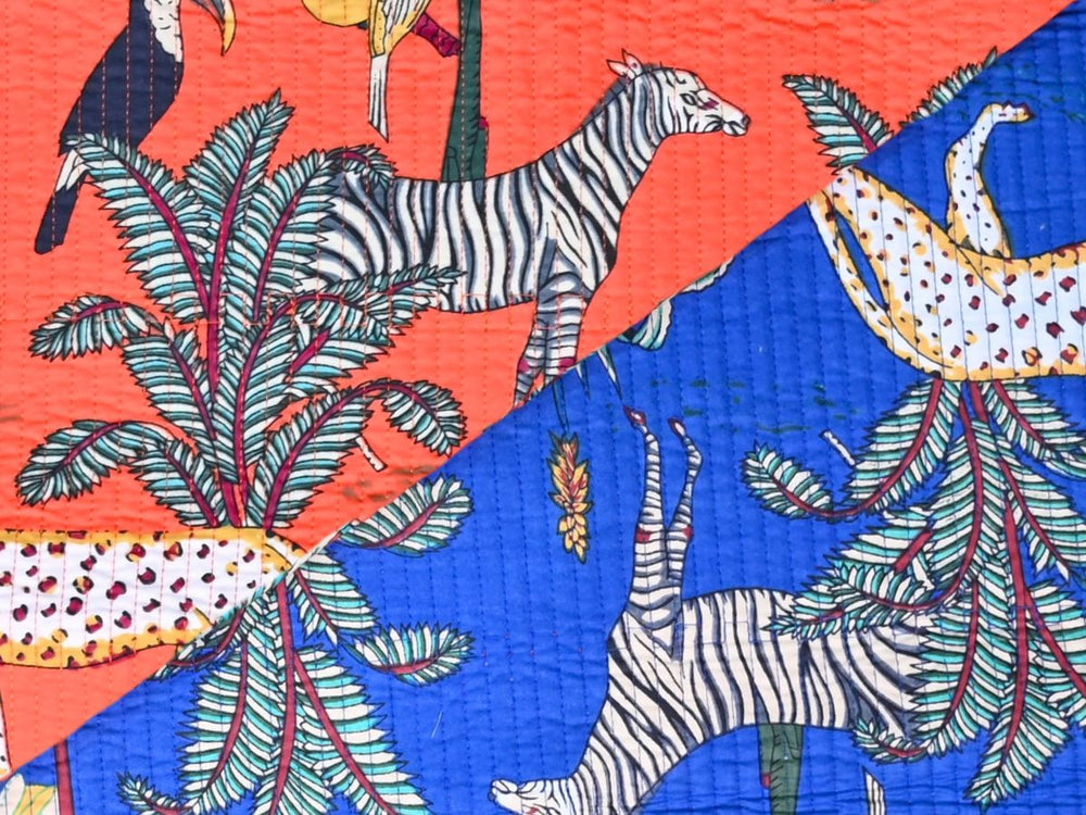 Close-up of coral quilted jungle fabric with diagonal stitch lines