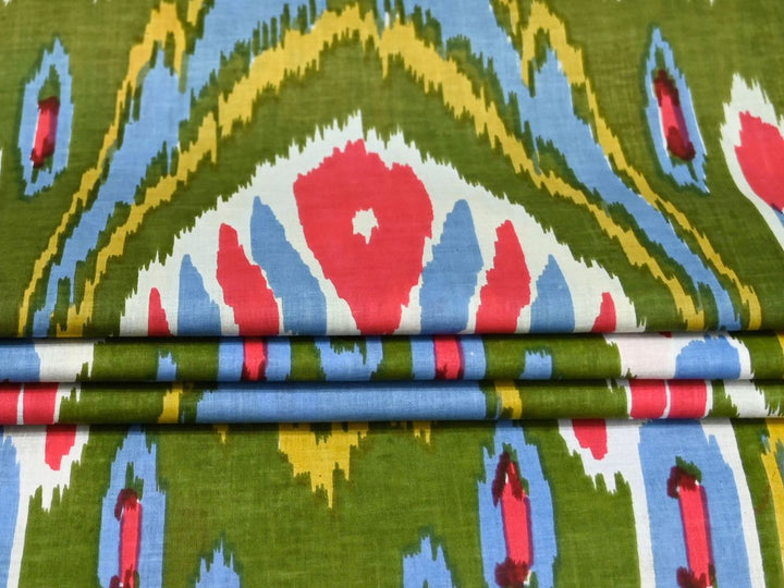 Traditional Indian ikat print fabric with red, sky blue, and mustard yellow accents