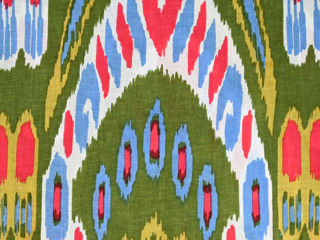 Indian ikat fabric online with olive green ground and bold red blue motifs