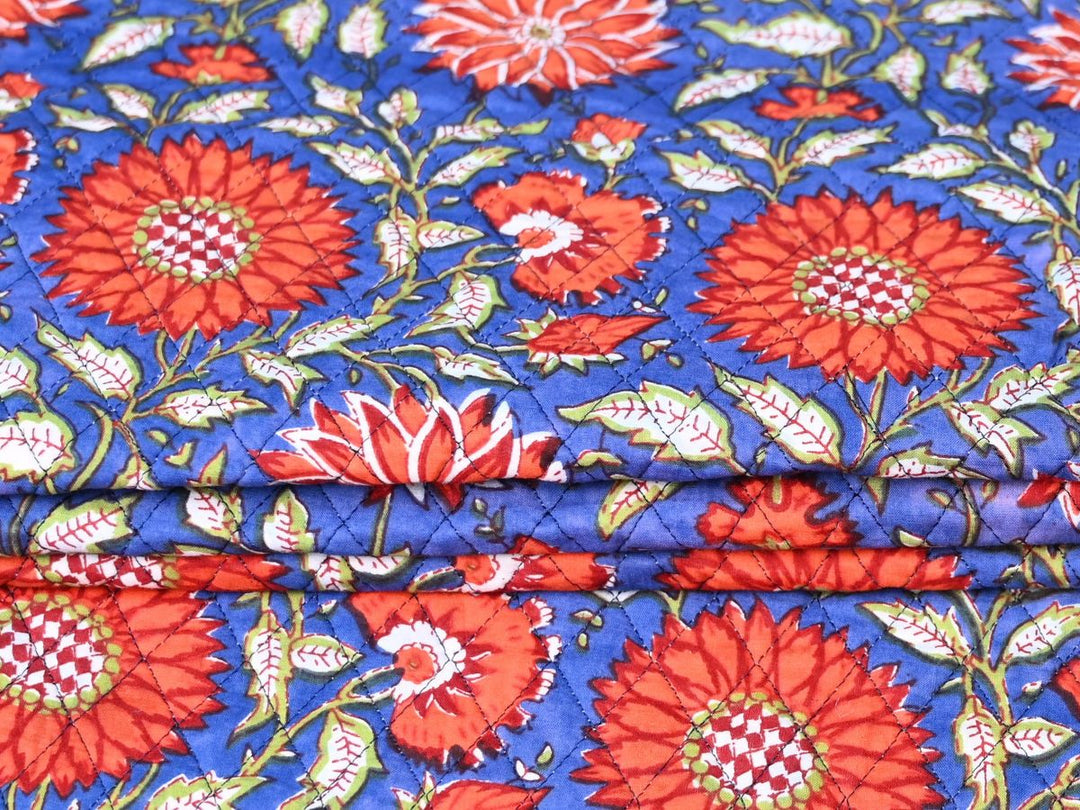 Reversible quilted fabric with navy blue and white striped reverse