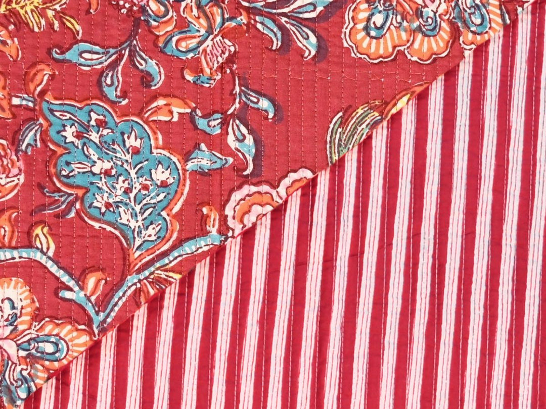 Deep red quilted fabric by the yard with large-scale floral block print