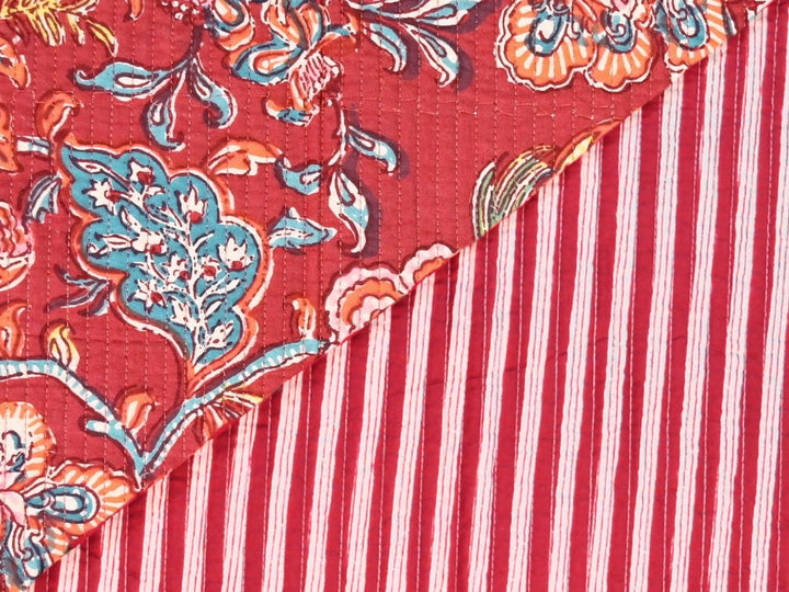 Deep red quilted fabric by the yard with large-scale floral block print