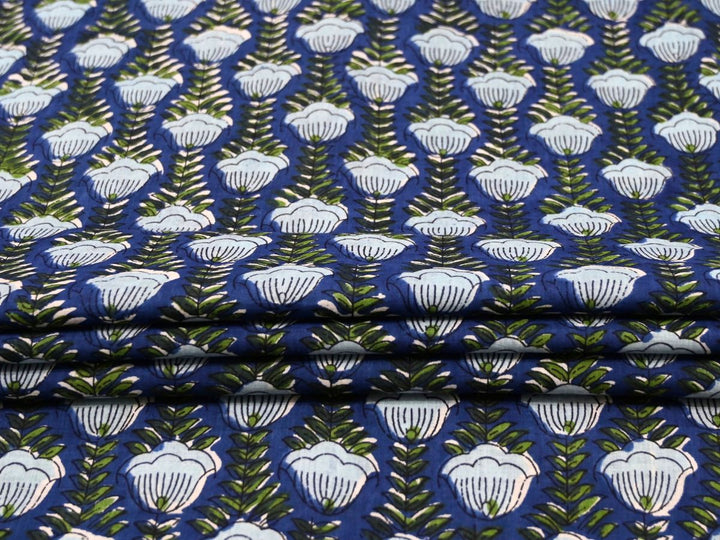Cobalt blue cotton fabric by the yard with white shell-shaped flower repeat