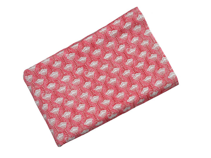Repeating white floral block print on soft peach ground