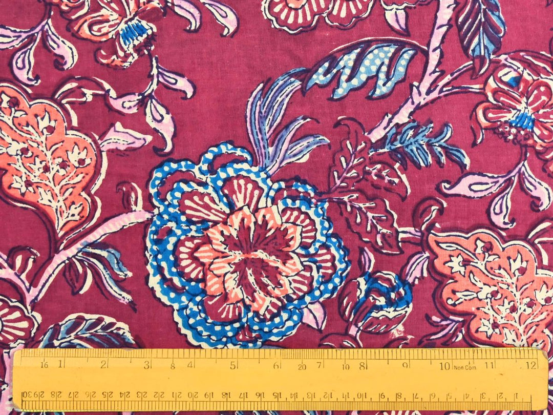 Large-scale floral block print fabric with lavender and blue foliage