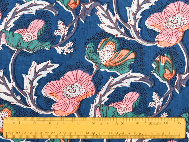 Large-scale floral woodblock print fabric with white outlined leaves
