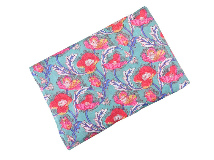 Close-up of pink poppy cotton fabric with dotted texture and detailed linework