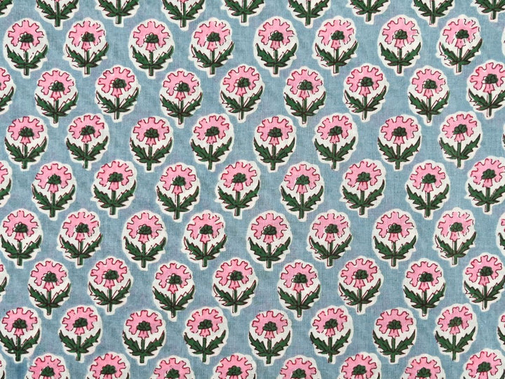 Grey cotton fabric showing pink flowers with green centers and foliage