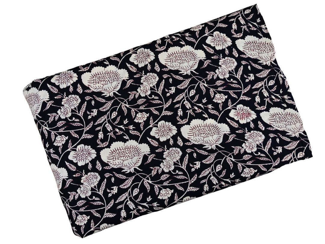 White outline floral fabric on black ground with detailed linework
