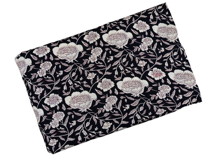 White outline floral fabric on black ground with detailed linework