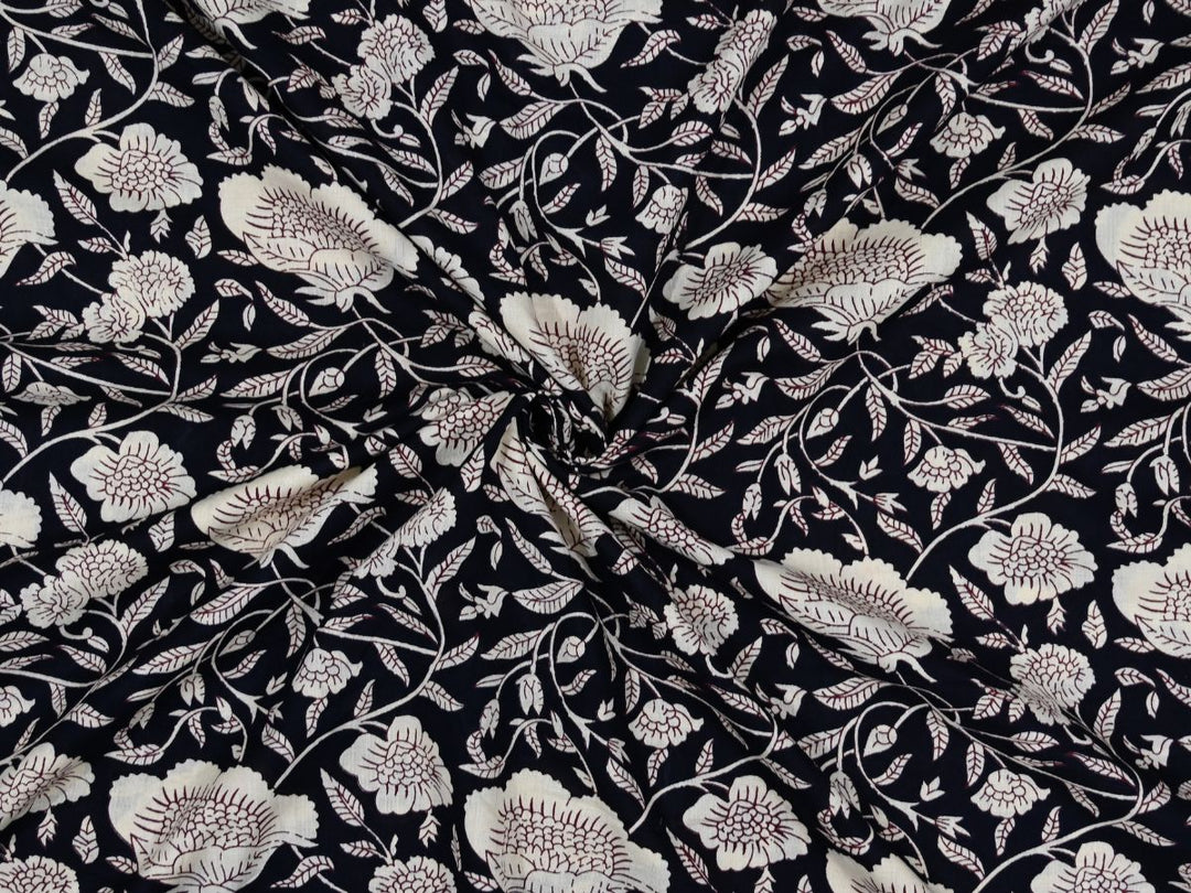 Black cotton fabric showing chrysanthemum-style white flowers and vines