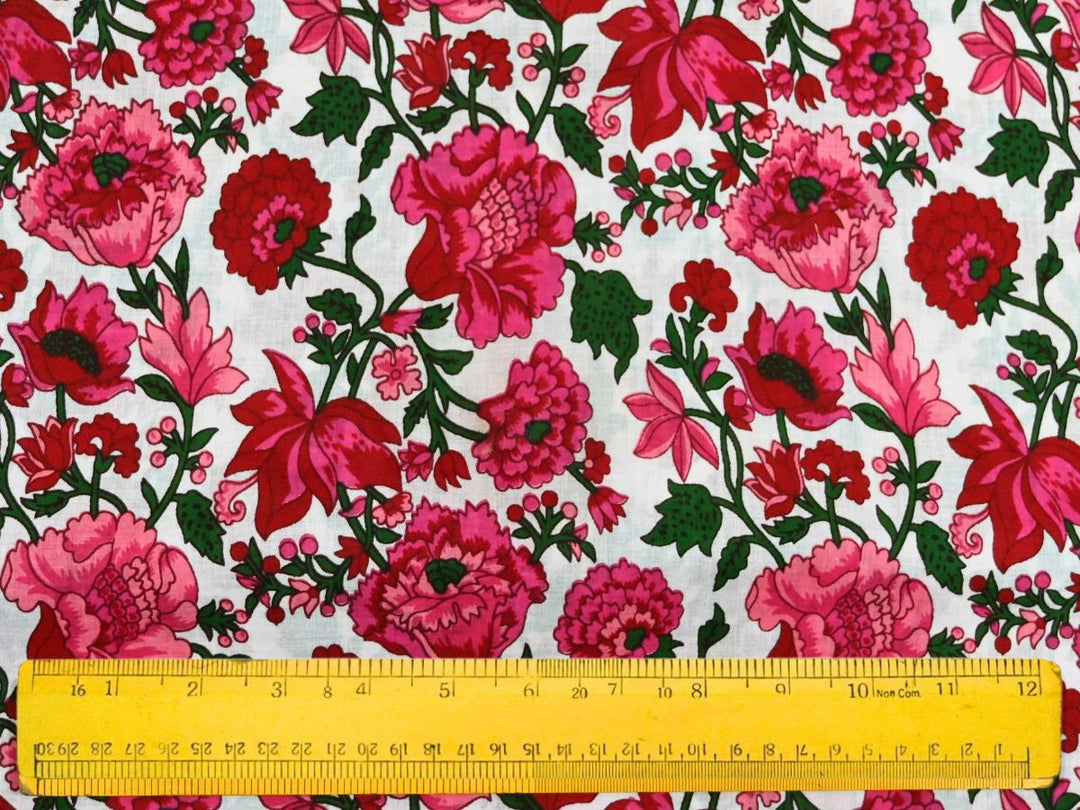 Fuchsia floral cotton fabric with dark green foliage and vines
