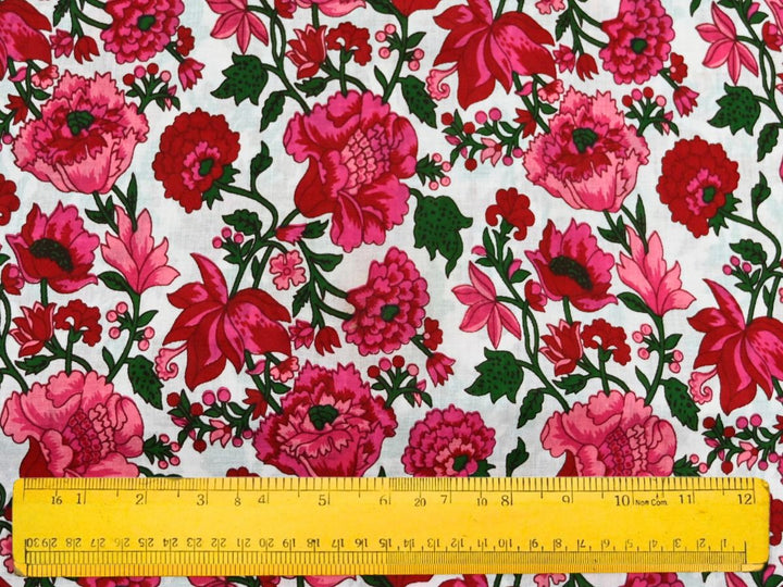 Fuchsia floral cotton fabric with dark green foliage and vines