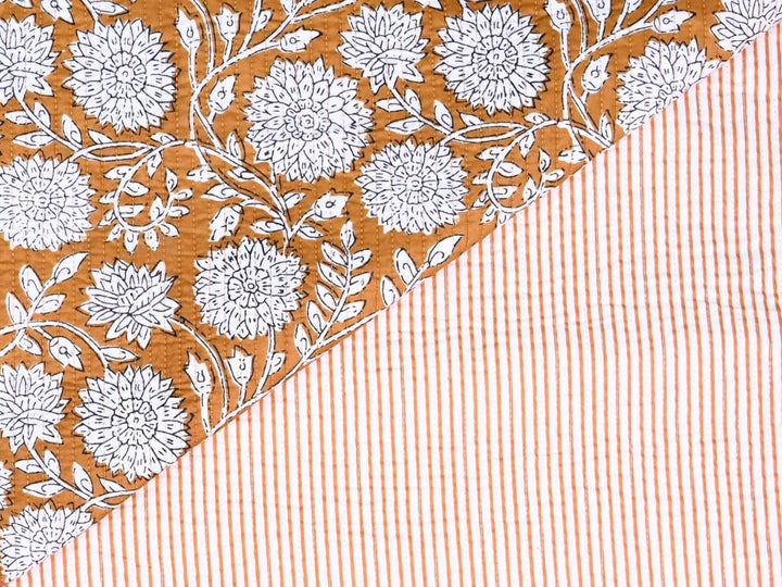 Quilted cotton fabric by the yard with mustard floral outline print