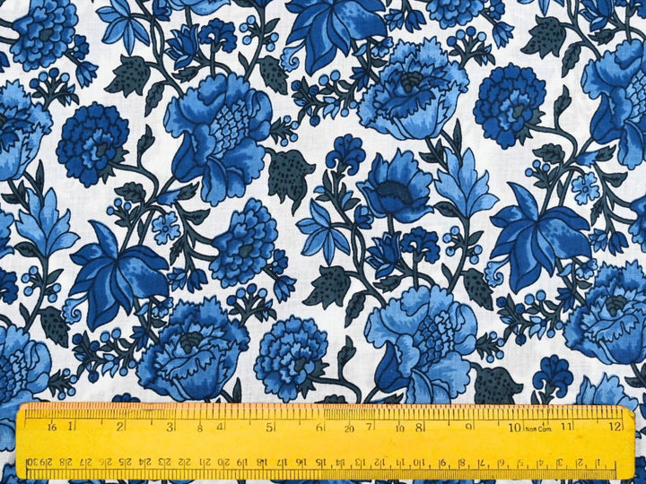 Blue and white floral cotton fabric with navy leafy vines