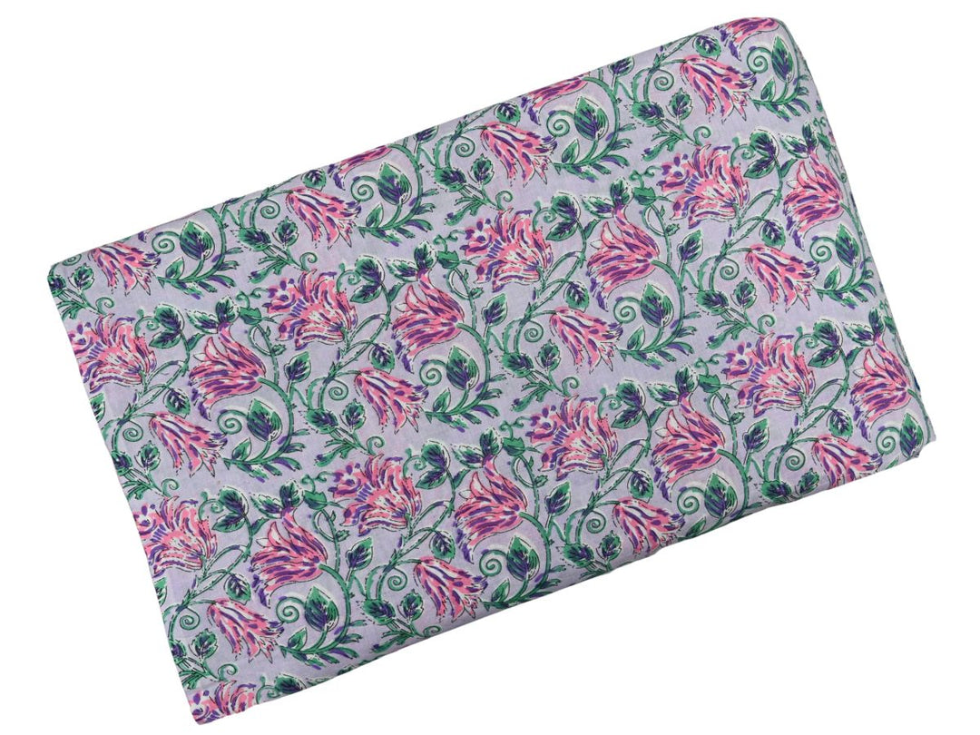 Repeating floral block print on lavender ground with spiral vine details