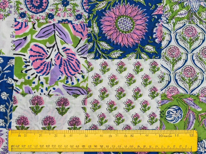 Close-up of patchwork print cotton fabric with detailed linework and multi-color design