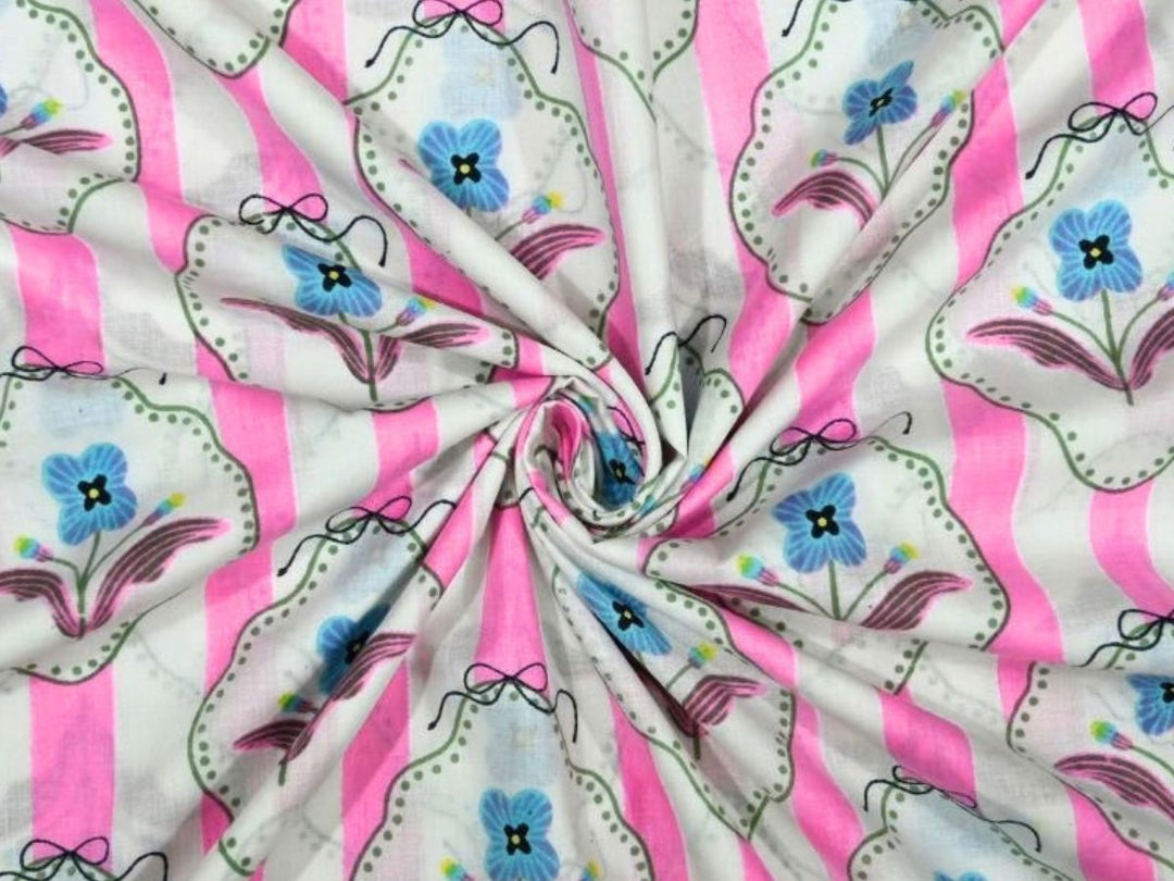 Pink and white striped cotton fabric with blue flowers in scalloped frames