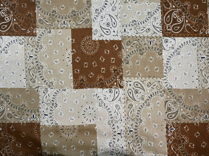 Brown patchwork bandana fabric showing paisley and floral medallion motifs