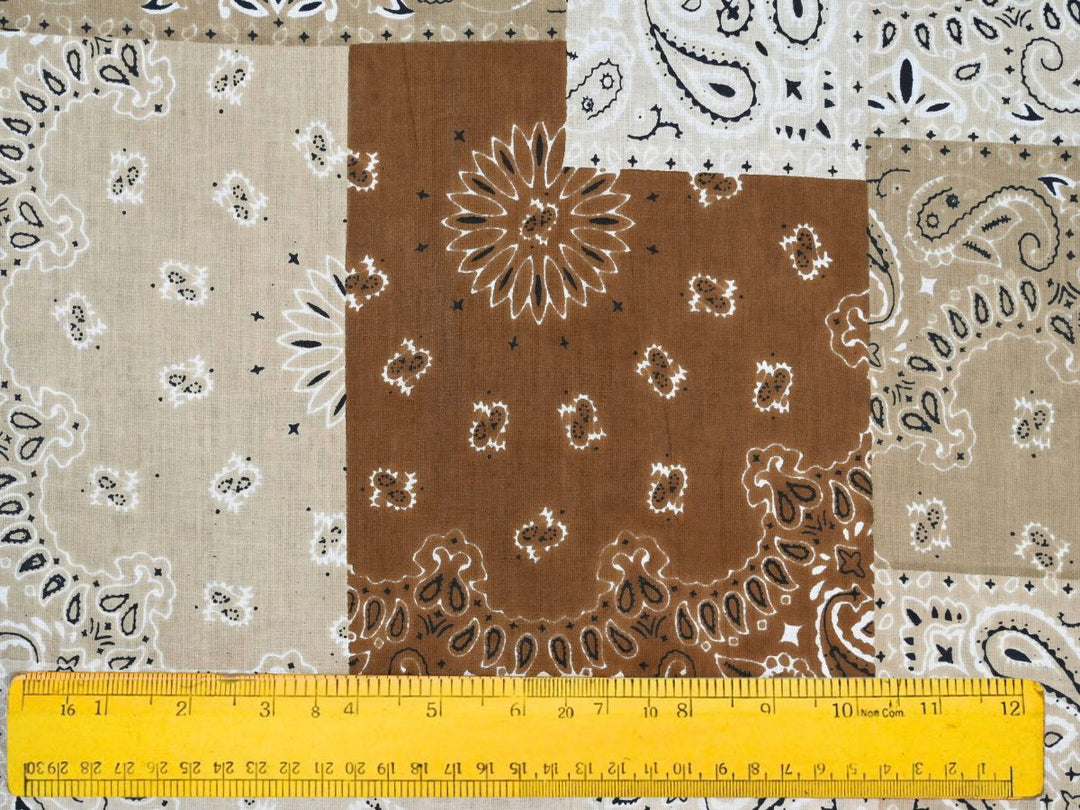 Close-up of brown bandana patchwork fabric with dotted border details