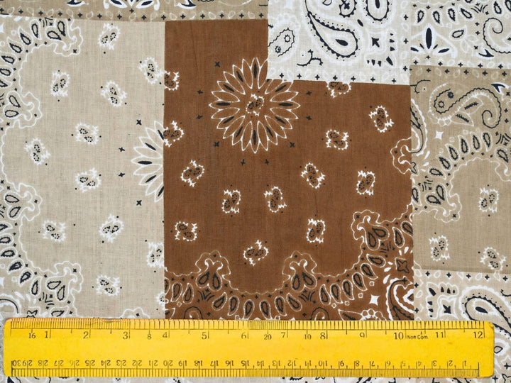 Close-up of brown bandana patchwork fabric with dotted border details