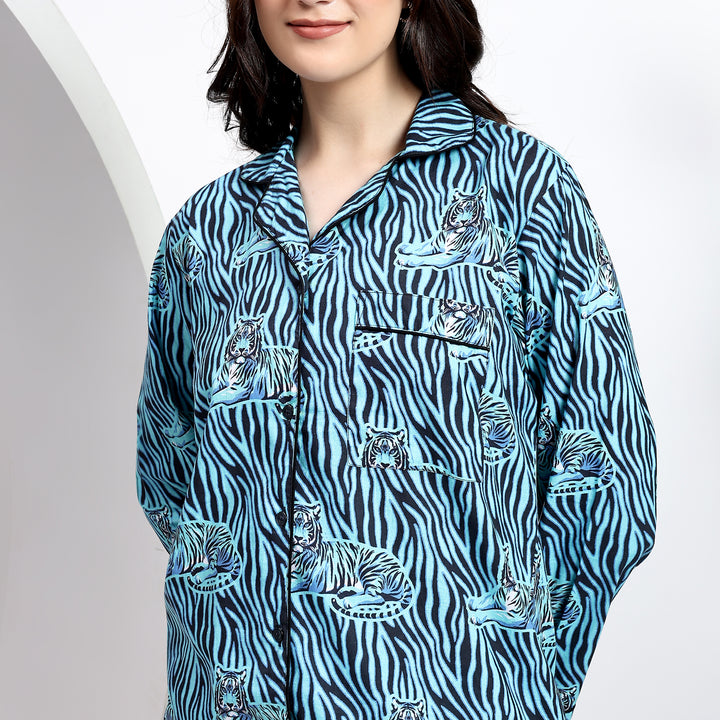 Close-up of glacier blue cotton pajama set with detailed top front pocket and handblock print fabric.