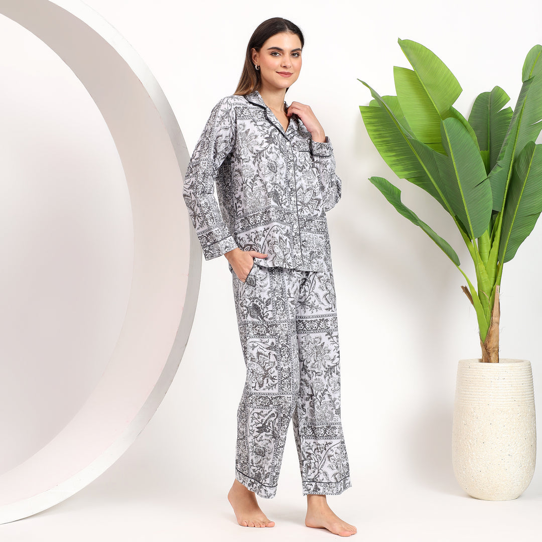 Side angle showcasing the stylish fit of off-white floral Long PJ Set with lapel collar."