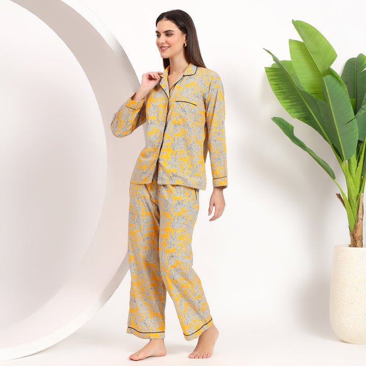 Side angle showcasing the stylish fit of yellow floral Long PJ Set with lapel collar.