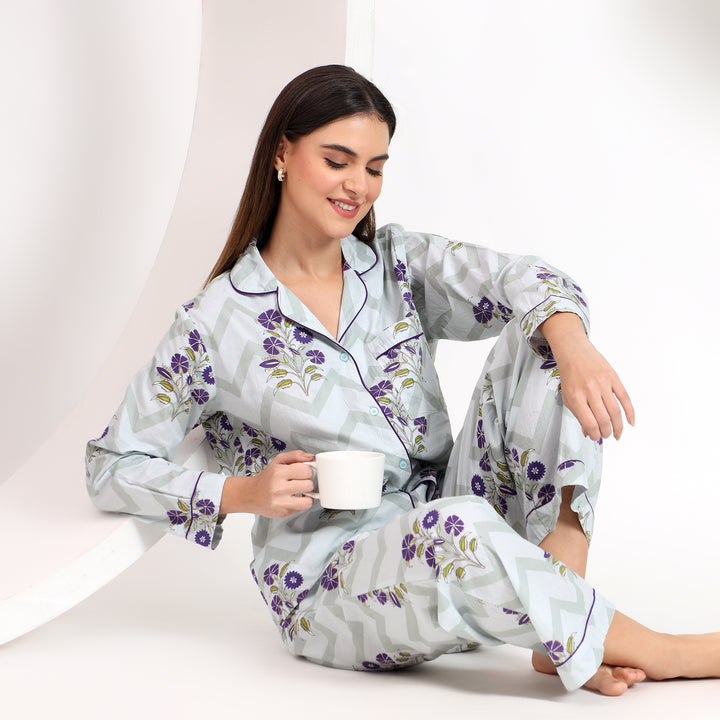 Close-up view of off-white cotton pajama set showing lapel collar and delicate lavender floral print, designed for cozy wear.