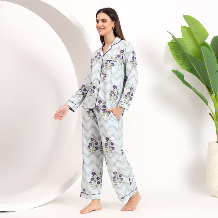 Close-up of the lapel collar on off-white cotton pajama set with lavender floral print, offering a refined and cozy look.