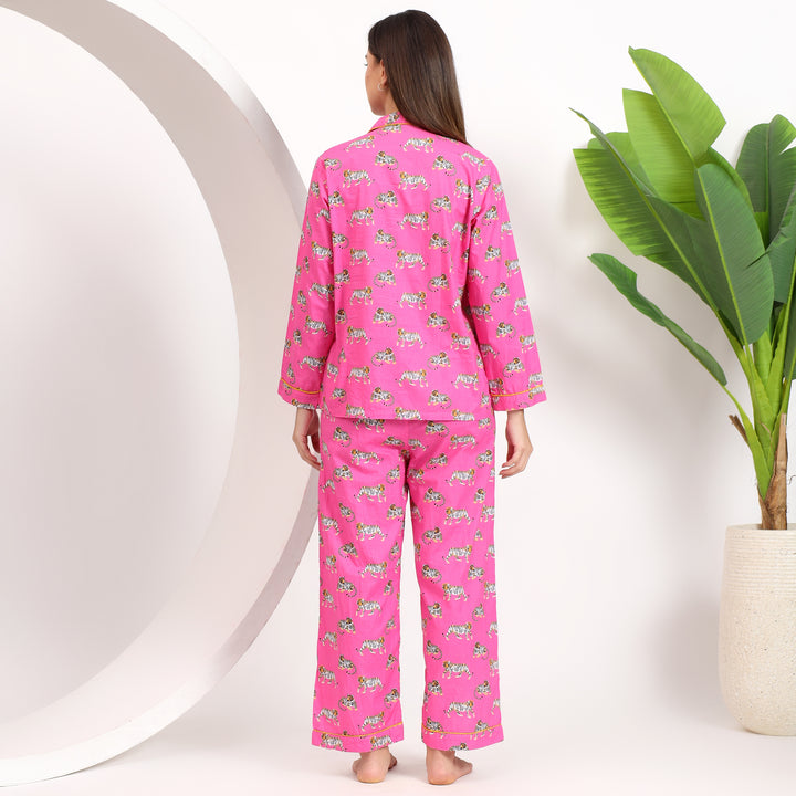 Back view of pink cotton pajama set with tiger print, lapel collar, and comfortable fit ideal for lounging.