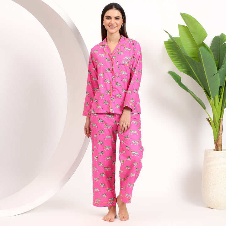 Front view of pink cotton pajama set with tiger print, featuring lapel collar and front pocket for added style and comfort.