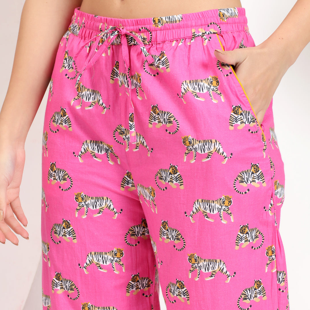 Side pocket view of pink cotton pajama set with tiger print, perfect for functional and fashionable loungewear.