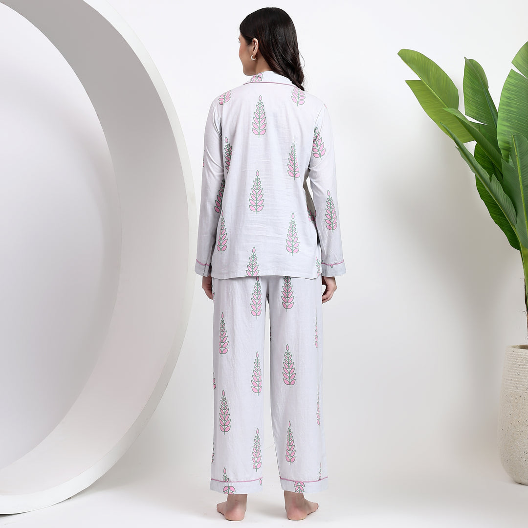 Back view of white cotton pj set featuring a lapel collar and floral handblock print for added elegance