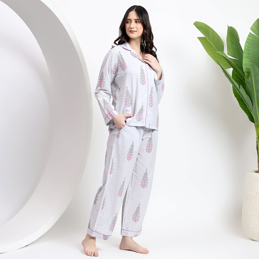 Standing view showcasing the white cotton pj set with side pockets and a comfortable, stylish fit in floral print.