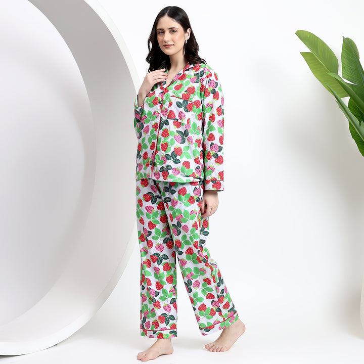 Side view of white cotton pajama set featuring side pocket and pink-red strawberry print for a casual, comfy look.