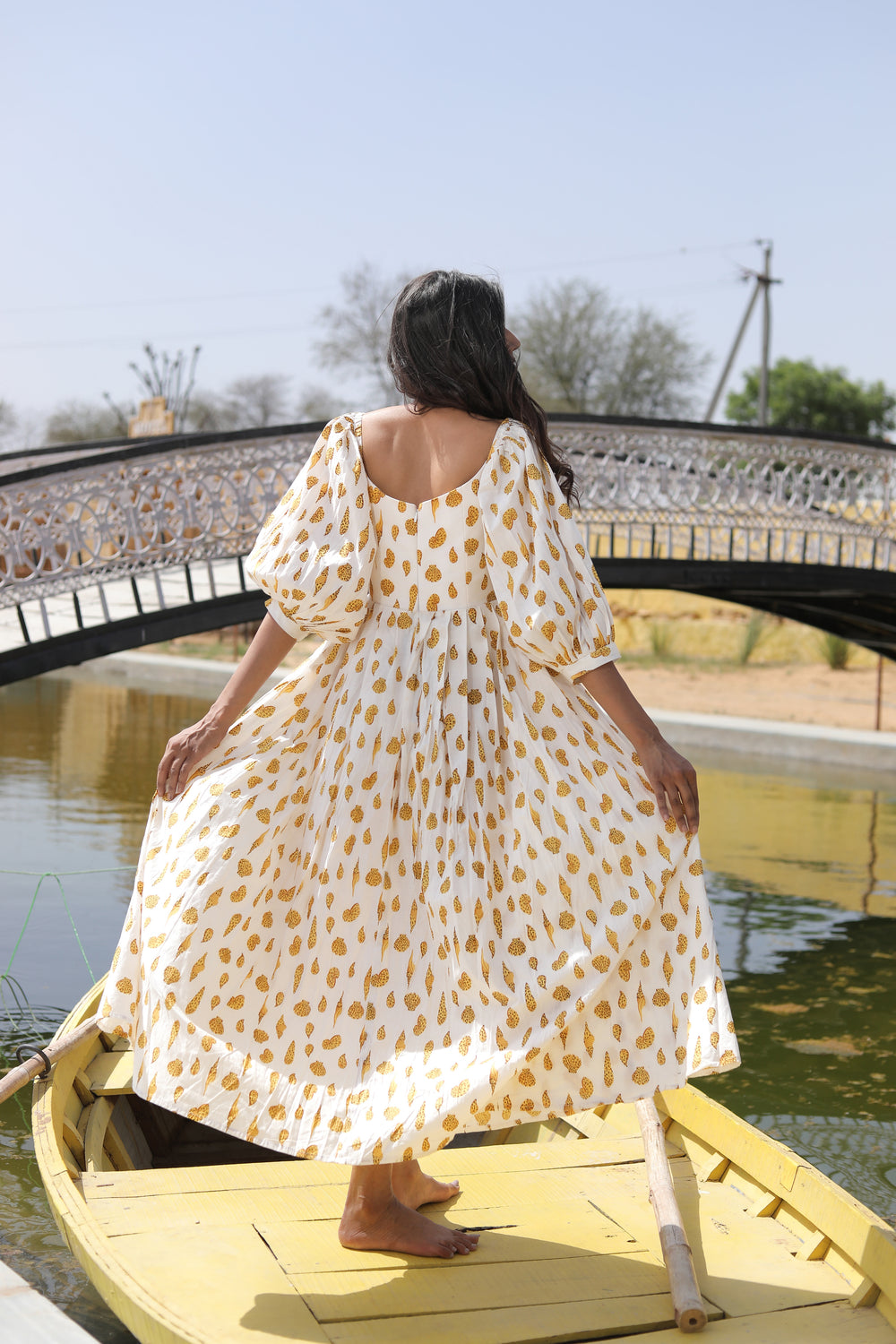 Yellow maxi dress with puff sleeves made from airy cotton fabric